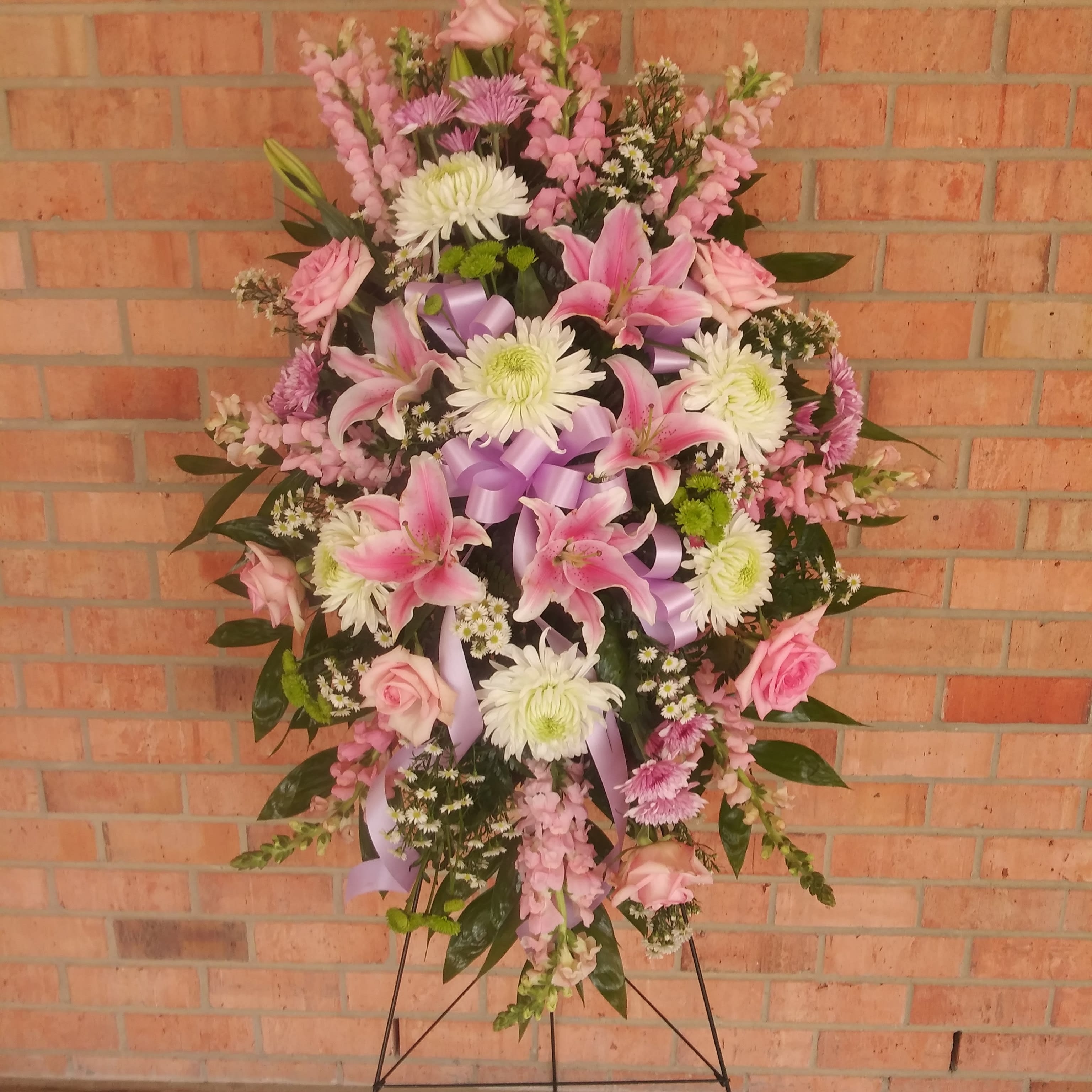 Pastel Peace Spray - Beautiful soft pastels with lillies, roses, snaps, and more to honor your loved one.