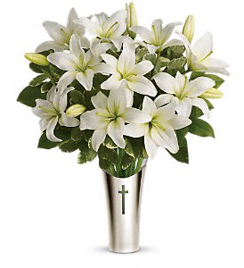 Sacred Cross Bouquet - Fragrant white lilies in a glass vase inside a silver sleeve adorned with a cross - a beautiful and meaningful way to honor the memory of a loved one.