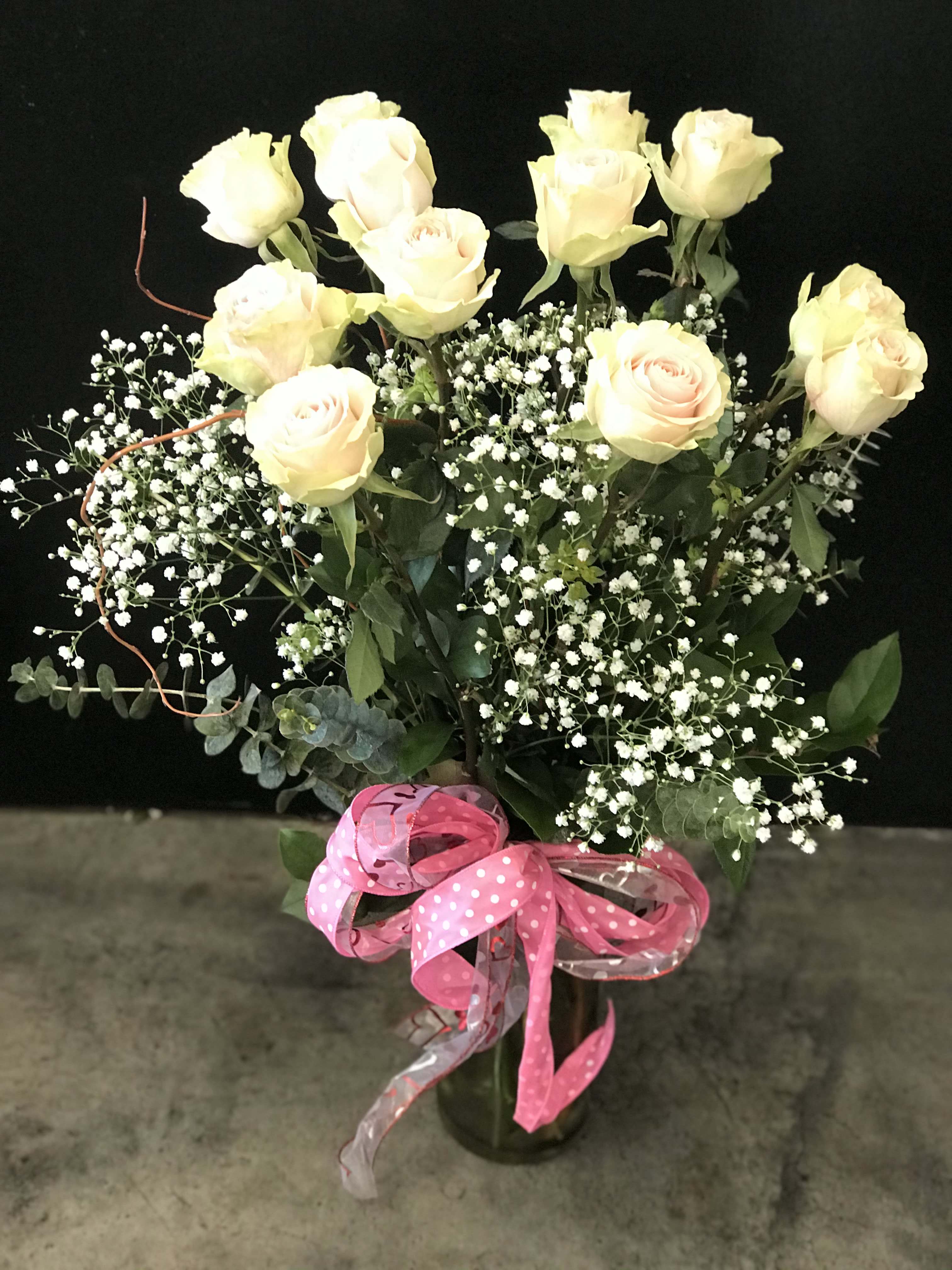 Light Pink Dozen - 12 Light Pink Roses in a vase with greens &amp; Babies breath