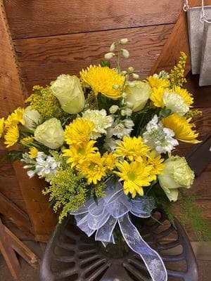Shades of Yellow Bouquet  - This lush bouquet is filled with dazzling blooms all in a vast array of yellow. Daisies, roses, mums and other seasonal yellow flowers fill this bouquet. 