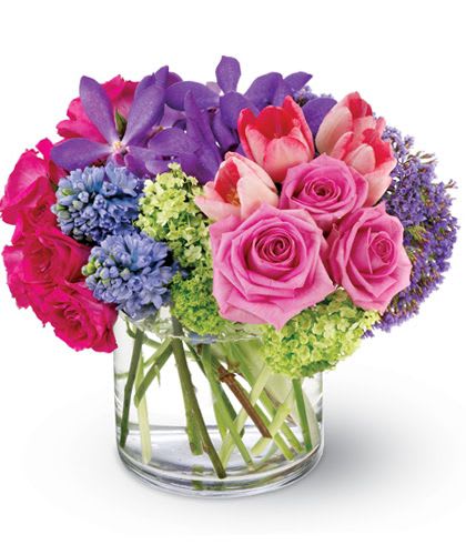 Spring Oasis - This beautiful spring bouquet created in a soft palette of purple, pink and green is like an oasis of calm sent to soothe a hectic life. A lovely addition to any decor. Send one to a special friend or treat yourself! Flowers types may vary depending on season, will substitute based on what is available and in similar color.