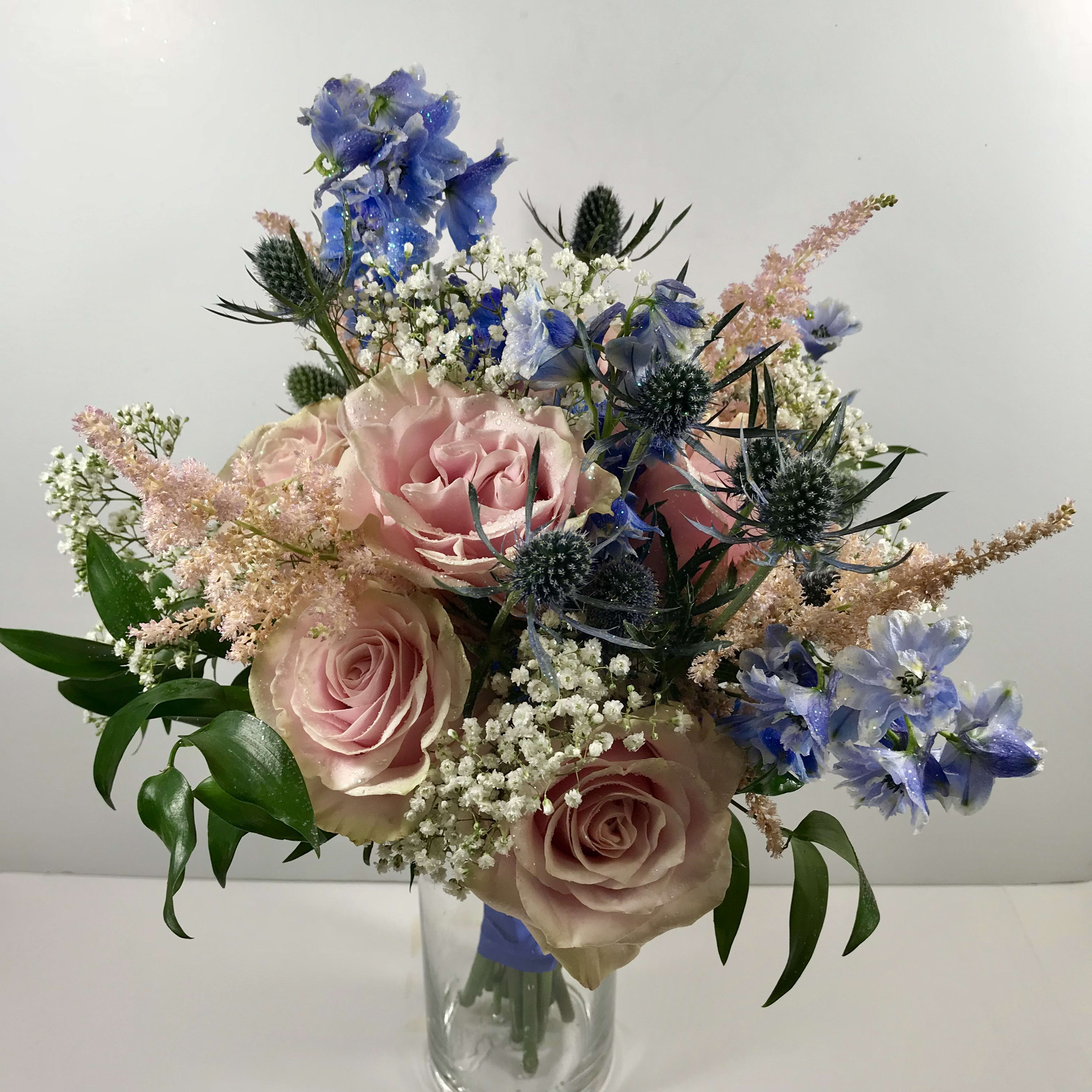 C61 Fabulous Prom Clutch - Romantic, garden style prom clutch which includes rose, delphinium, thistle and astilbe.    Each order is customized to go with your date's beautiful gown.