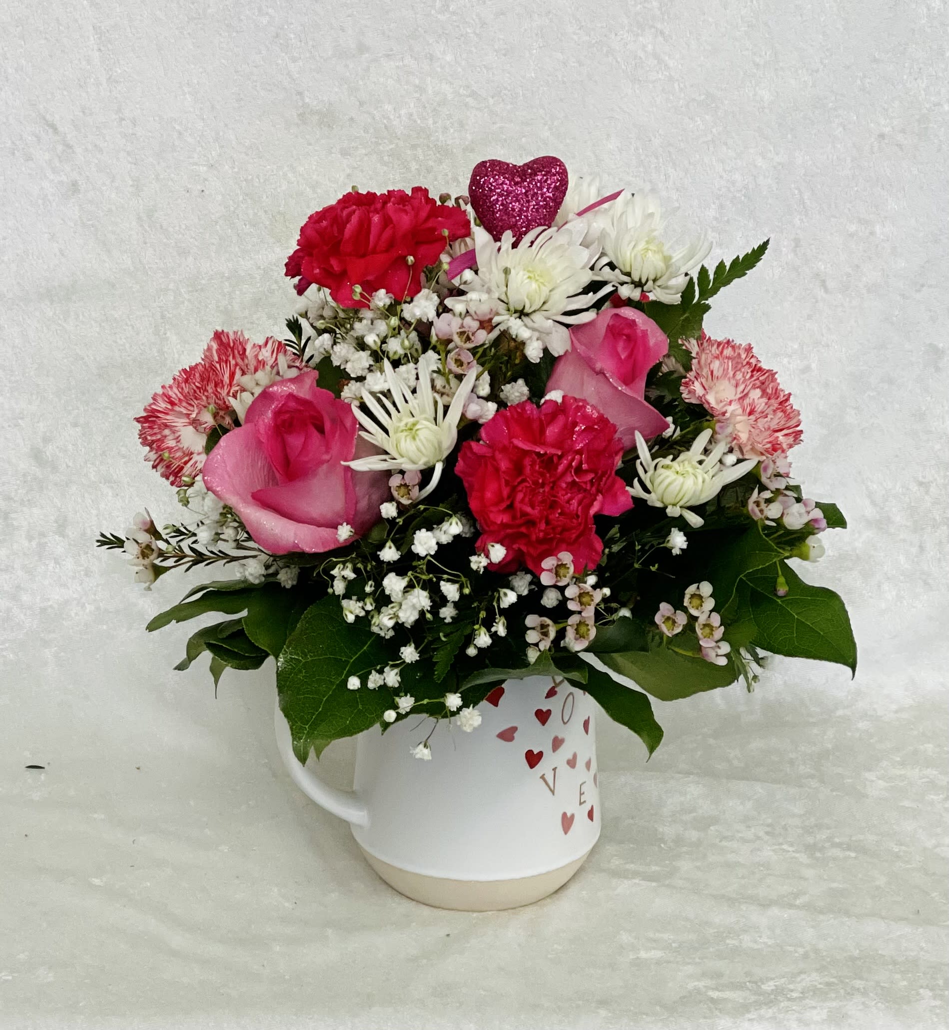 Love Mug Love Mug - More than an arrangement! Show her love with this Beautyful bouquet.