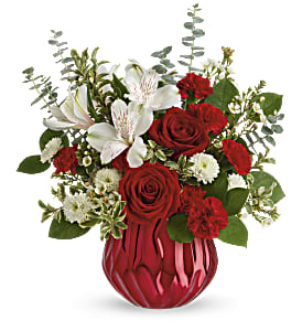 Heart Shine - Send a truly enchanting gift this Valentine's Day with this delicate red rose bouquet, presented in a swirling ceramic vase with sparkling metallic finish.This lovely arrangement features red roses, white alstroemeria, miniature red carnations, white button spray chrysanthemums, white wasflower, spiral eucalyptus, pitta negra and lemon leaf. Delivered in Teleflora's Enchanted Gem cylinder. Approximately 12 1/2&quot; W x 14 1/2&quot; H