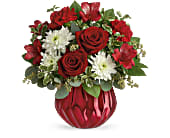 Gemstone Love - Like a radiant ruby, this special ceramic vase has a bold metallic finish that sparkles in the light. What an enchanting way to surprise your special someone with a classic red rose bouquet! Red roses, red alstroemeria, red carnations, white cushion spray chrysanthemums and pitta negra are accented with seeded eucalyptus and lemon leaf. Delivered in Teleflora's Enchanted Gem cylinder. Approximately 12&quot; W x 12&quot; H