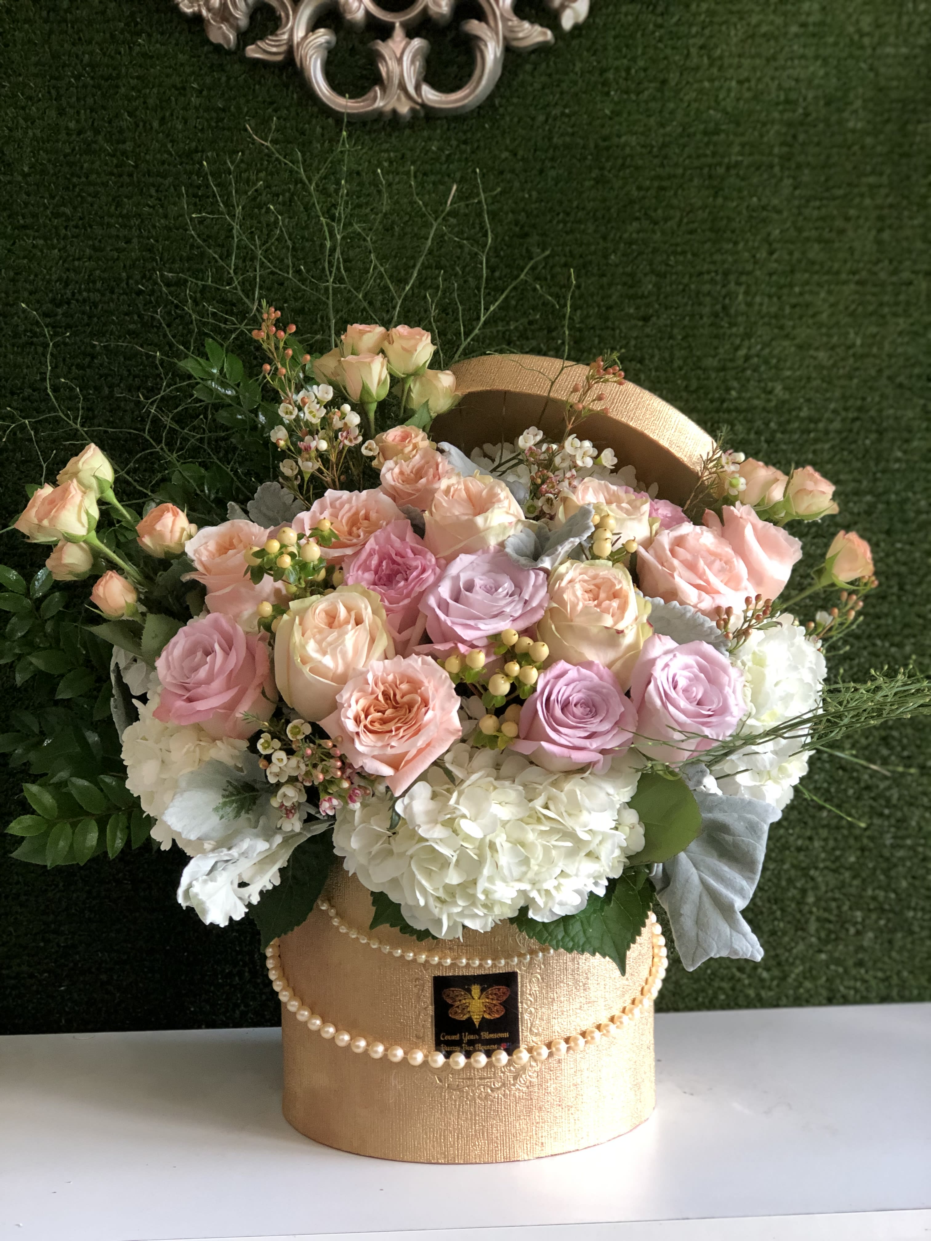 Audrey Hepburn  - This beautiful arrangement is designed to deliver happiness to a loved ones day. Filled with beautiful flowers and customized to perfection, this arrangement is a showstopper! If you want to turn heads then this is the arrangement for you! Inspired by late actress Audrey Hepburn!