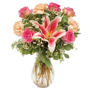 Yes Please Bouquet Yes Please Bouquet - Yes, yes...a thousand times yes! That's what Mom as well as just about any other special people on your list will say as they receive this glorious bouquet of roses, stargazer lilies, waxflower and carnations in a clear swirl vase.