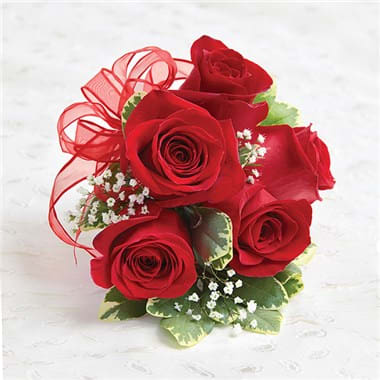 1-800-FLOWERS® RED ROSE CORSAGE - Make them stand out in a crowd with this classic corsage arrangement. For proms, weddings, or any celebration, our expert florists have hand-designed a stunning red rose wrist corsage that will make her the hit of the party.  Large corsage features 5 roses, Small features 3 roses. Our florists hand-design each arrangement, so colors, varieties, and container may vary due to local availability.