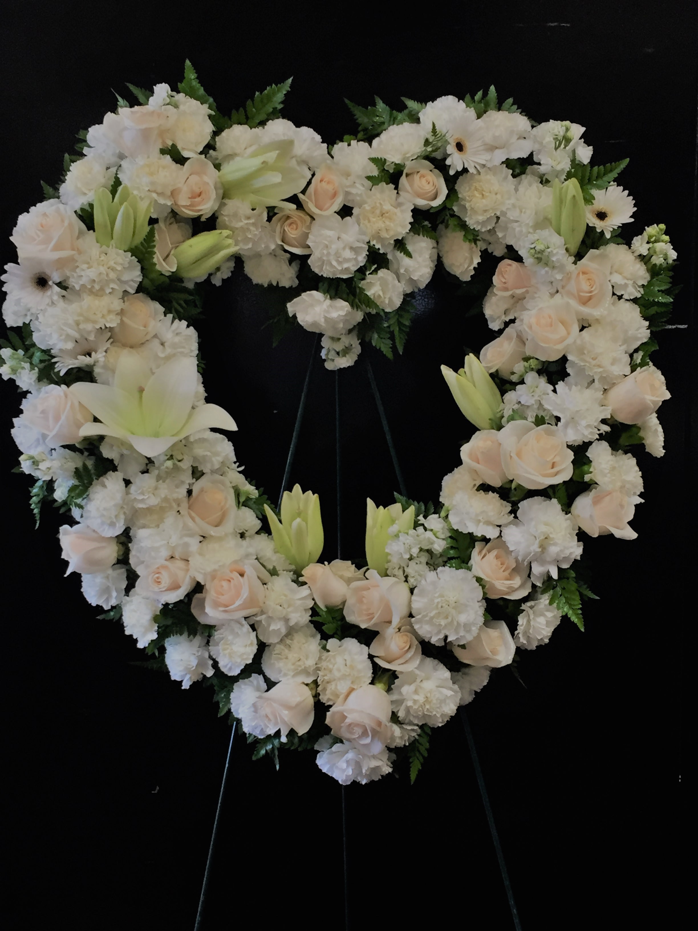 Everlasting Love - All white standing open heart Delivered on a 5 foot easel Roses, Lilies, Mums, and Carnations   