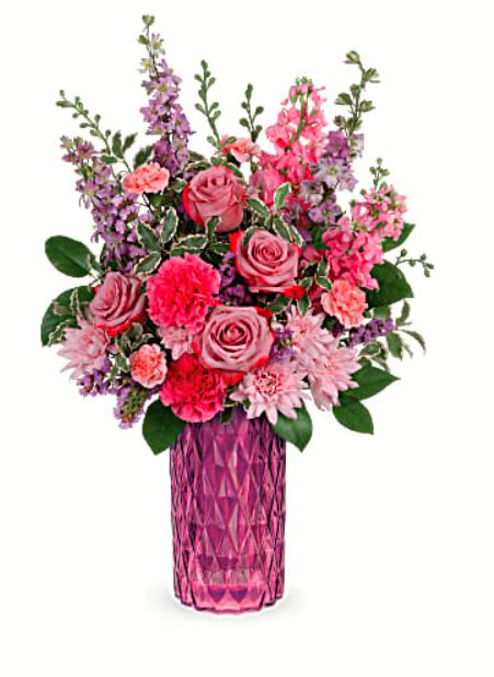Amazing Amethyst Bouquet Amazing Amethyst Bouquet - Lavish mom with luxury! This magnificent lavender rose bouquet reaches new heights of glamour in a stunning diamond-cut, amethyst-hued vase. This amazing bouquet includes lavender roses, purple larkspur, pink stock, purple carnations, lavender cushion spray chrysanthemums, miniature pink carnations, purple sinuata statice, lemon leaf and pitta negra. Delivered in Teleflora's Amazing Amethyst vase while supplies last.