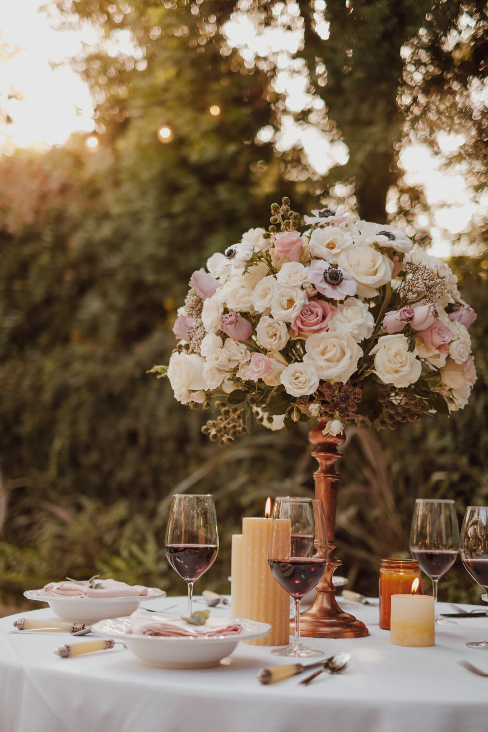 The Centerpiece — Romantic - A floral centerpiece brings the whole table together, exuding elegance and natural beauty that is sure to make your guests breathe deep and appreciate the wonder of being together. Work with one of our florists to craft the perfect centerpiece tailor-made for your decor, table settings, and event mood — the dome shape of this arrangement style complements round tables and creates a warm, comforting feel.