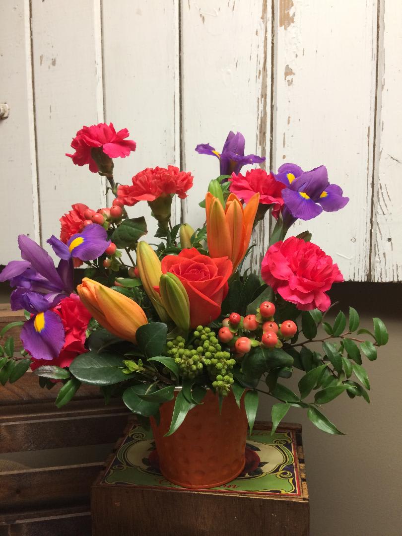 Simply You Custom Designed Bouquet by Cold Spring Floral - Simply You is perfect for Birthdays, Anniversaries, Parties with its Bright colored Blooms. Purple Iris, Orange Lilies and Roses, Hot Pink Carnations, Hypericum Berry and mixed greenery makes a beautiful burst of color! Flowers and Container are subject to substitutions due to availability. 