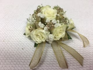 W4 Spray Rose  Wrist corsage  - Delicate, petite roses accented with pretty ribbon and sparkling bling.  In order to best match her dress, give us a call.  Each corsage is customized to her amazing dress.  Want to make your date's night?    