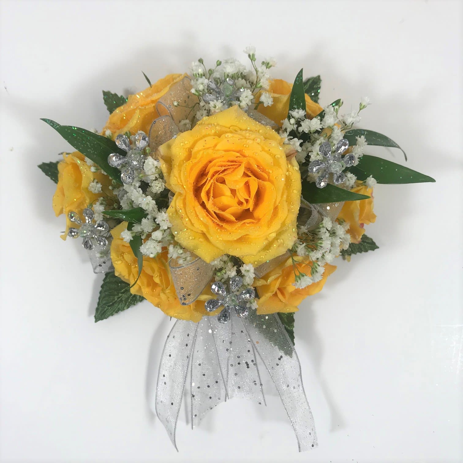 W24 Yellow Spray Rose Wristlet - This wristlet corsage features yellow roses with sparkly white bow and jewels.  Each order is customized to go with your lady's gorgeous dress.