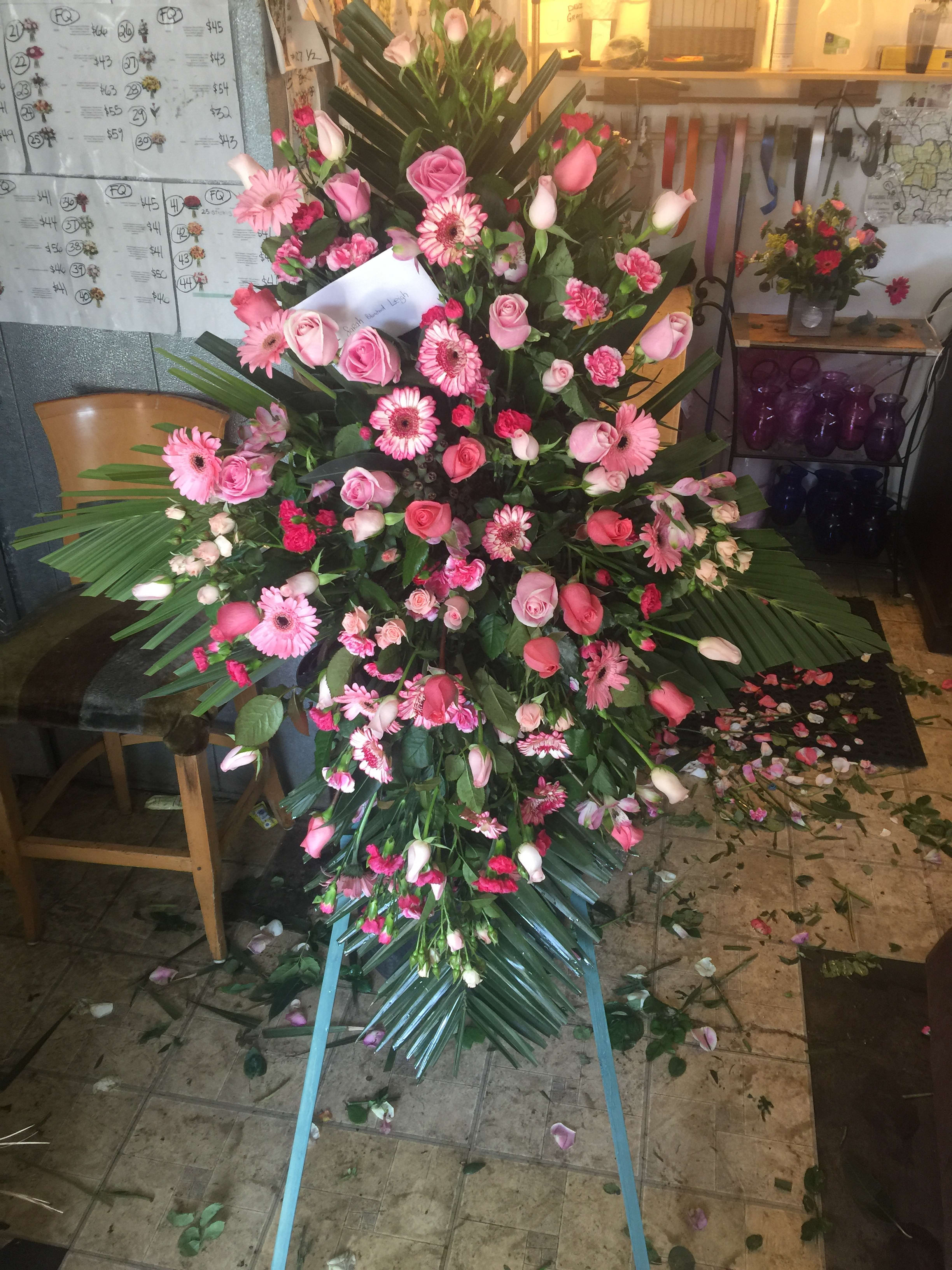 OUR DEEPEST CONDOLENCES- PINK TONES - SEND YOUR WARM WISHES WITH THIS WONDERFUL EASEL, FULL OF PINK BLOOMS, FEATURING ROSES, LILIES, GERBERS AND SNAPS.