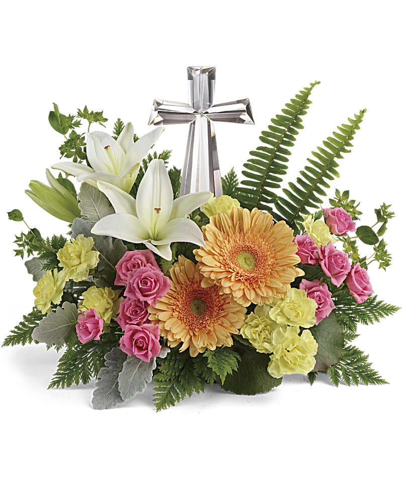 Precious Petals Bouquet - Nestled among bright orange gerberas, pink roses and white lilies, this precious crystal cross keepsake brings joyful reverence to your special occasion. Pink spray roses, white asiatic lilies, light orange gerberas, and yellow miniature carnations are accented with bupleurum, dusty miller, galax leaves, sword fern, and leatherleaf fern. Delivered with a Crystal Cross keepsake.