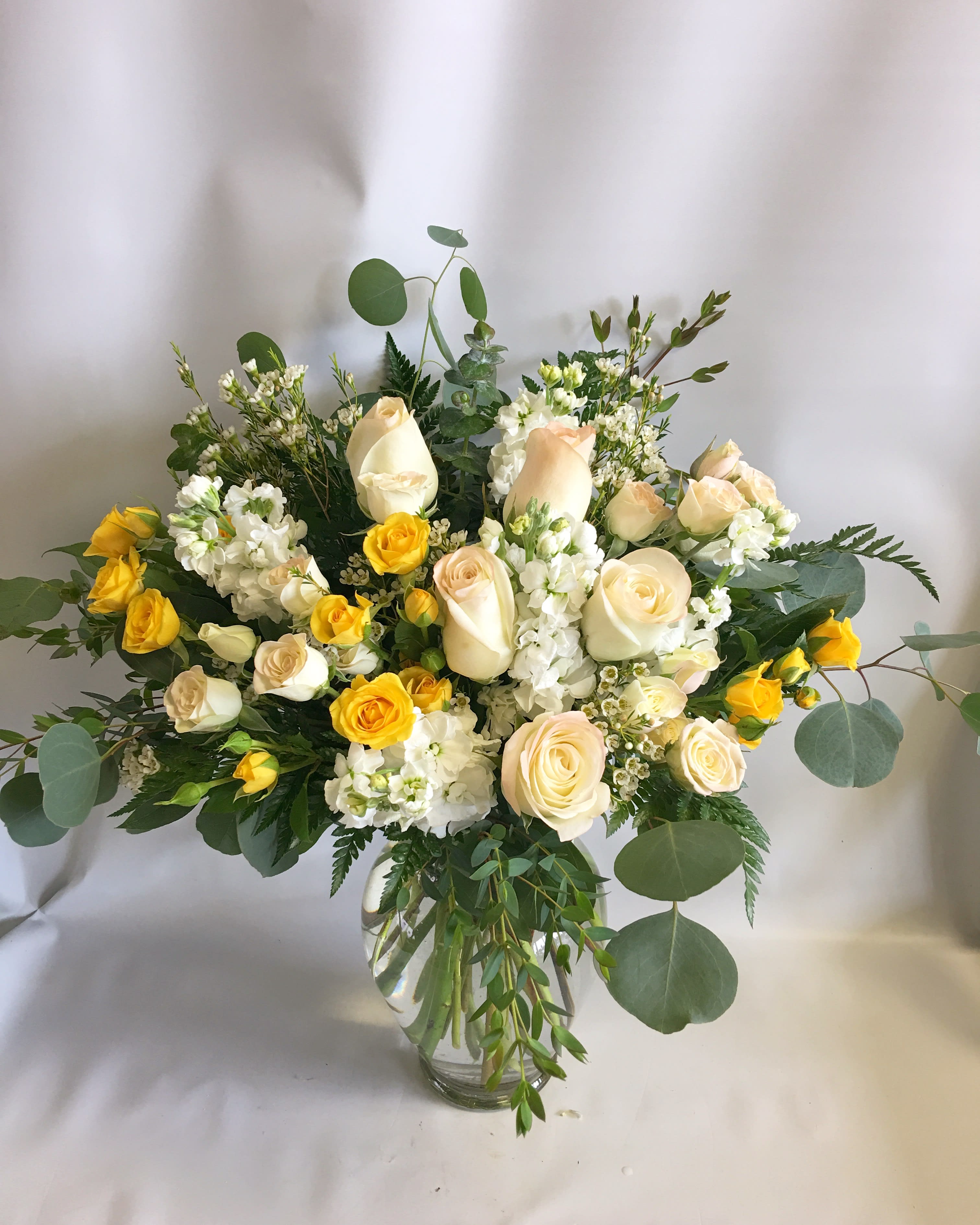 Hearty & Happy Hearty & Happy - Flourishing with happy blooms. Gift someone you know who absolutely loves roses. especially in the warm and happy tones! Upgrades include much more roses!