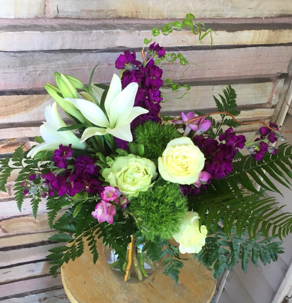 &quot;Purple rain &quot; - White roses, purple freesia,purple stock, Asiatic lily and sword fern. 