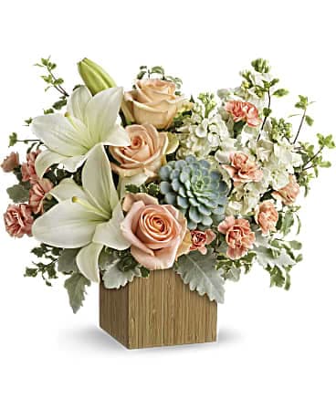 Desert Sunrise Bouquet - Reminiscent of a desert sunrise, this modern mix of peach blooms, white lilies and succulents is a super chic statement in a natural bamboo cube.