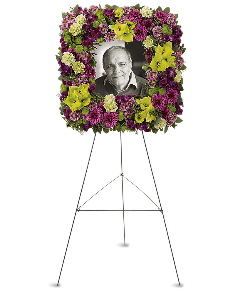 Mosaic of Memories Square Easel Wreath Mosaic of Memories Square Easel Wreath - A unique and lovely tribute for the service this contemporary square easel wreath of purple and green flowers is a gift of caring expressed with beauty and style. The elegant arrangement includes purple alstroemeria green gladioli green carnations purple cushion spray chrysanthemums lavender button spray chrysanthemums green button spray chrysanthemums and purple button spray chrysanthemums accented with assorted greenery.