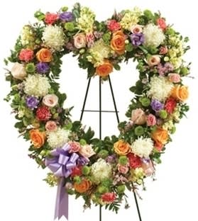 MULTICOLOR STANDING OPEN HEART MULTICOLOR STANDING OPEN HEART - When words aren’t enough to express your sympathy and love, this open heart standing spray of pastel blooms conveys your condolences beautifully.