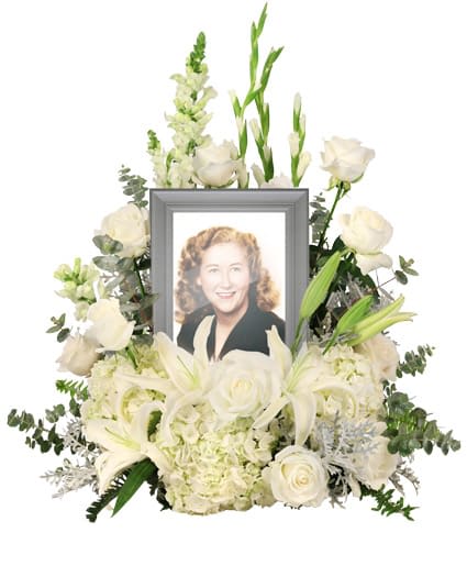 Eternal Peace)Memorial Flowers - Reminisce and cherish the life of a lost loved one with the Eternal Peace memorial arrangement that encompasses a photograph of your choice and adds a personal touch. This classy arrangement features heavenly white hues with lavish hydrangeas, lilies, and roses, making it ideal for any memorial service. ( Picture Frame Not Included)