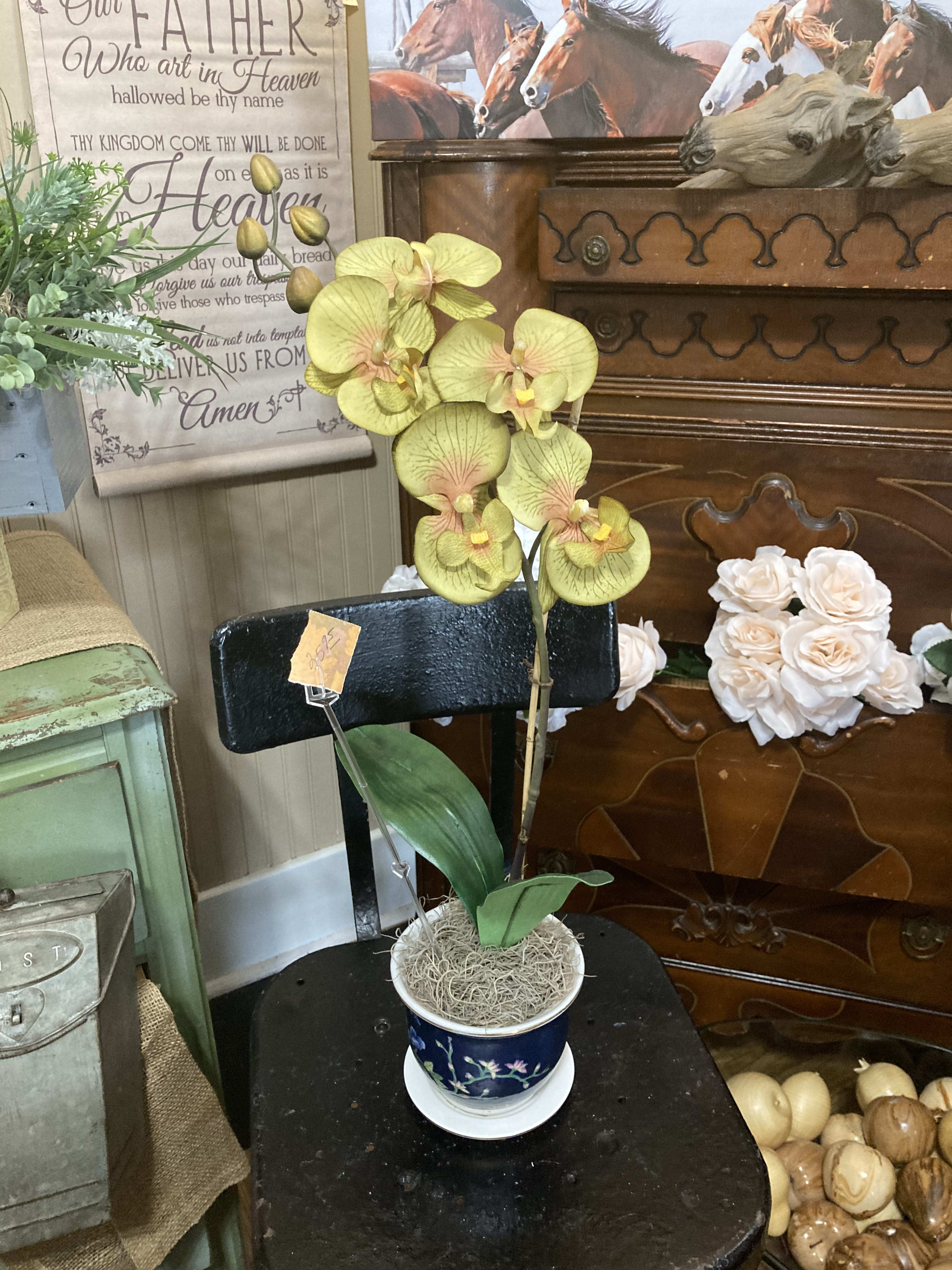 Silk Orchid  - Mix up your decor with a silk orchid, created in a lovely blue pot. Lovely and Fabulous! Perfect for your patio or deck to add a little extra color and flair. 
