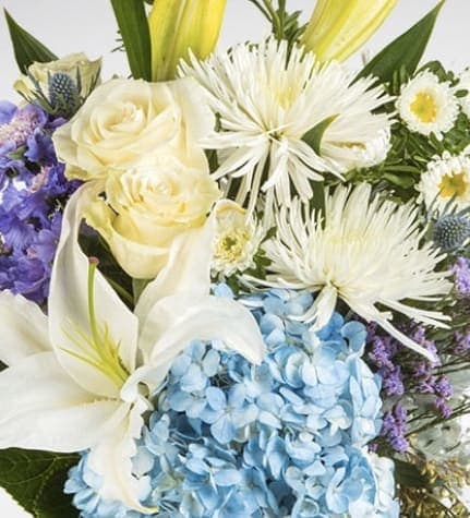 Cool and Refreshing Blues Cool and Refreshing Blues - Cool blues and soft yellows are the focus in our designers choice delicate bouquet. Let our La Pine top designers create a one of a kind arrangement for your loved one.