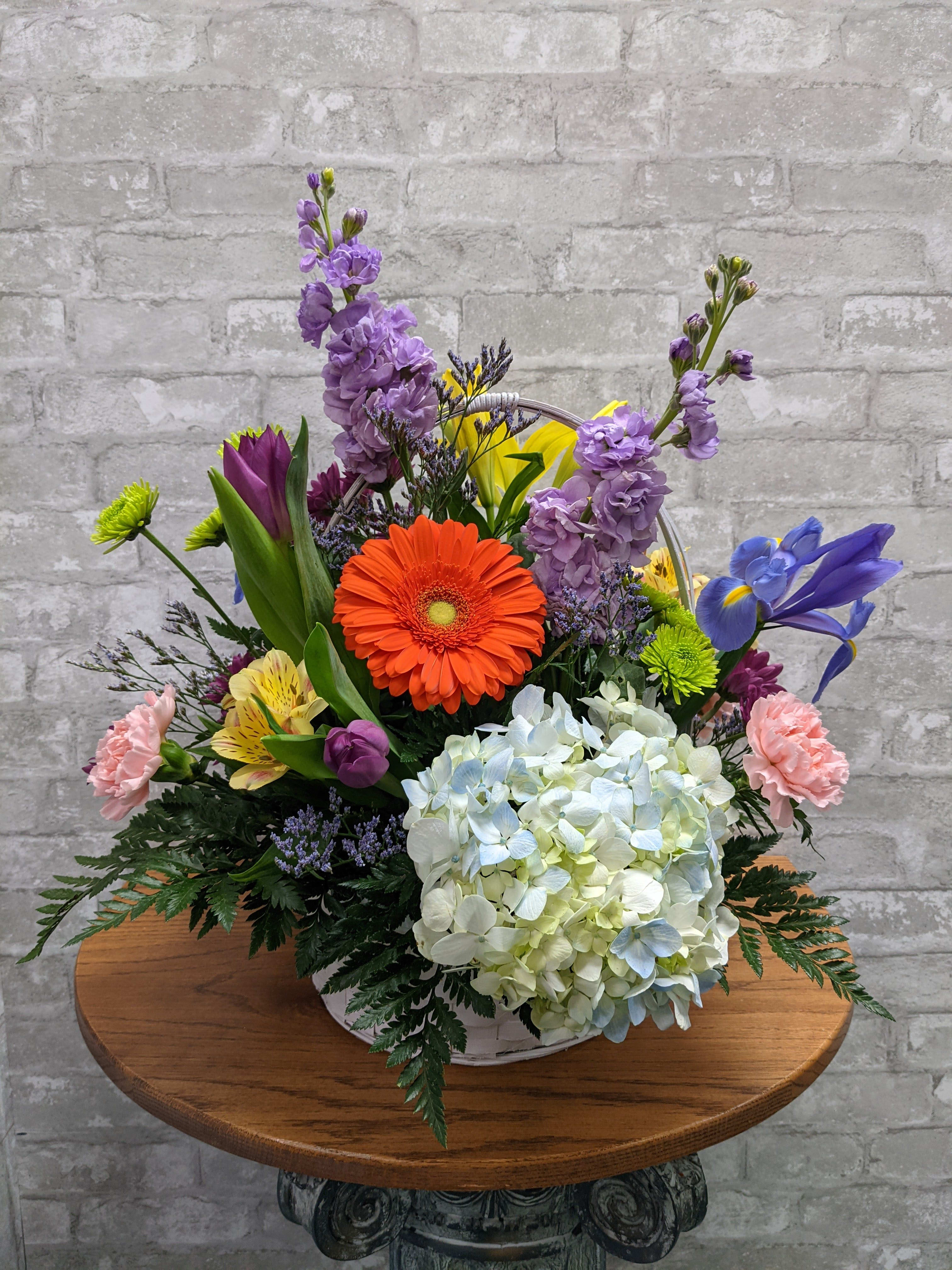 Grand Easter Basket FG553 - Large round wicker basket full of beautiful spring flowers.    Approximately 21&quot; H x 19&quot; W.