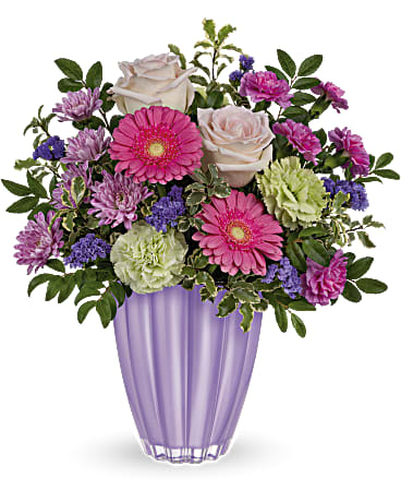 Playful Pastel Bouquet - Put a spring in their step with this playful bouquet of pink and purple blooms, presented to perfection in a pastel purple vase of European glass with radiant metallic finish.