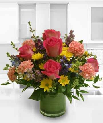 Joy To You Joy To You - Joyful arrangement of brightly colored roses, daisys, carnations and delphinium Components may vary