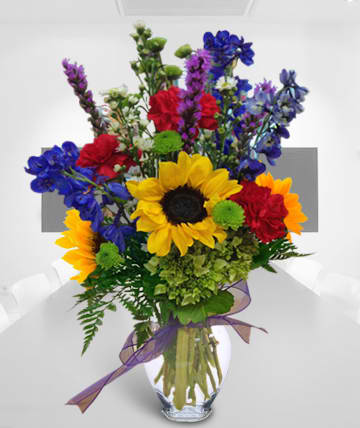 Summer Spirit Summer Spirit - Bright sunflowers mixed with other blooms is full of summer spirit. Substitutions of equal or greater value may be made depending on season and availability of product or container.