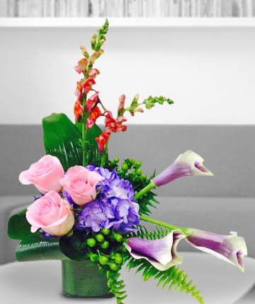 Stylish Beauty  - Delightful arrangement of roses, calla lilies, hydrangea, and snapdragons.  Substitutions of equal or greater value may be made depending on season and availability of product or container. 