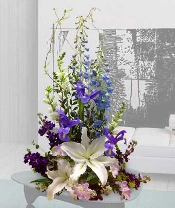 Uplifting - Uplifting arrangement of lilies, delphinium, snapdragons, iris, stock, and alstromeria  Components may vary 