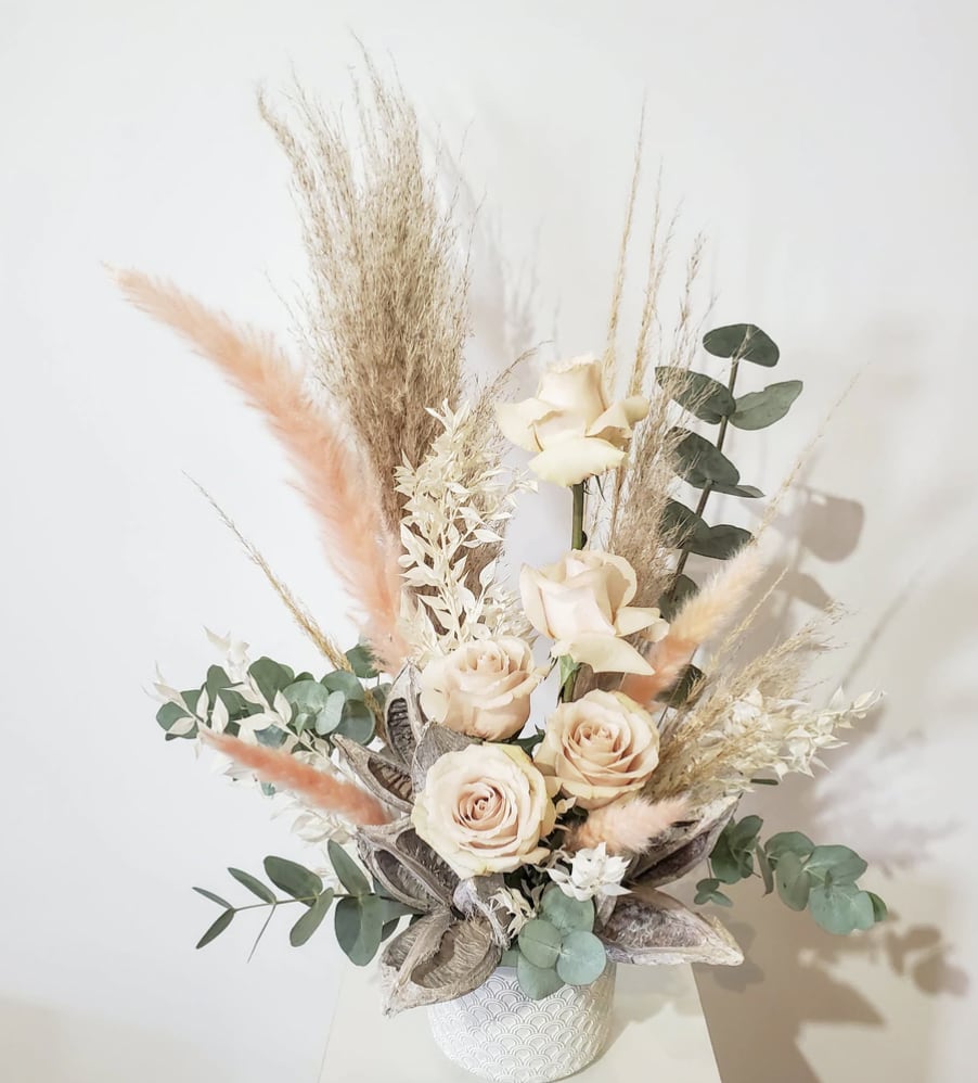 Natural Delight Natural Delight - A bit of Boho and a current and on trend flair make this the perfect arrangement to match any setting