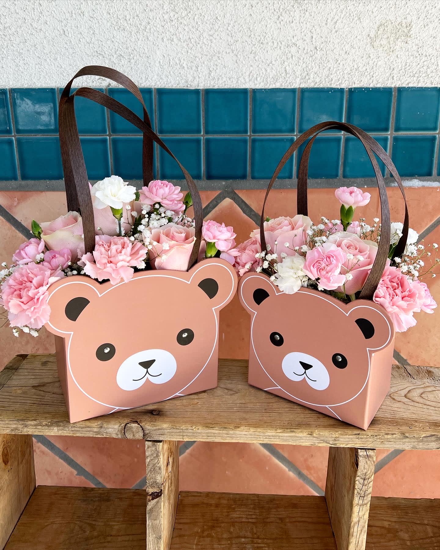 Mommy and Me bouquets - A set of 2 bear arrangement for mom and her baby. Roses, carnation, and baby breath in white and pink are beautifully arranged inside  a flower box in the shape of teddy bear. Two color bear to choose from: brown and black. If no bear color is mentioned, we will choose for you.