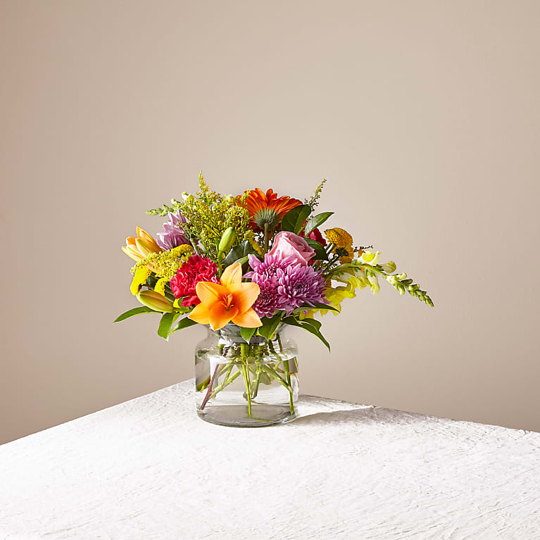 Party Punch Bouquet Party Punch Bouquet - PARTY PUNCH BOUQUET A touch of sherbet shades and textured beauty all in one standout bouquet. Filling our signature vase is a selection of lilies, snapdragons, gerbera daisies and more designed by an artisan florist.