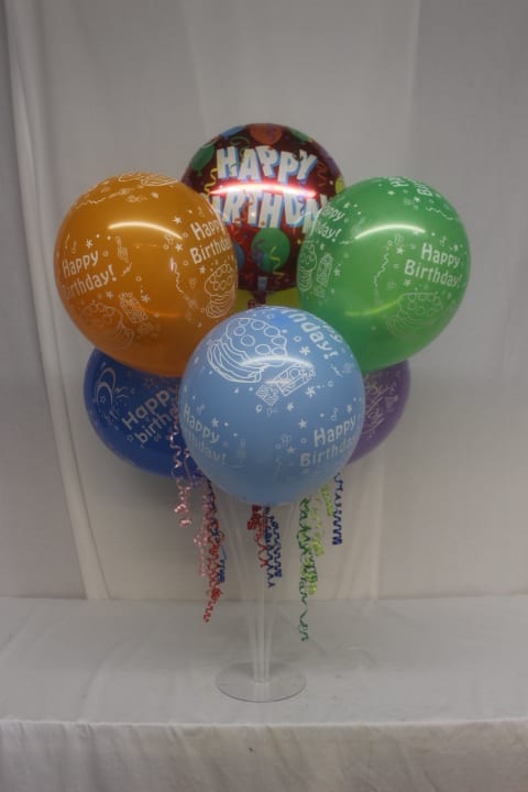 Balloon Bouquet Stand - This fun and festive balloon bouquet will be the perfect centerpiece of any party. It includes one Mylar balloon top and center, surrounded by 6 Latex balloons. Birthday smiles abound with this delivery!!