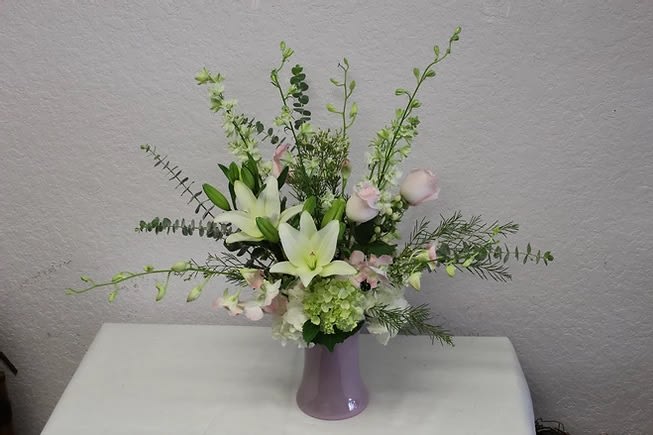 CFE106 CFE106 - Hydrangeas, stock, lilies, roses and orchids beautifully arranged.