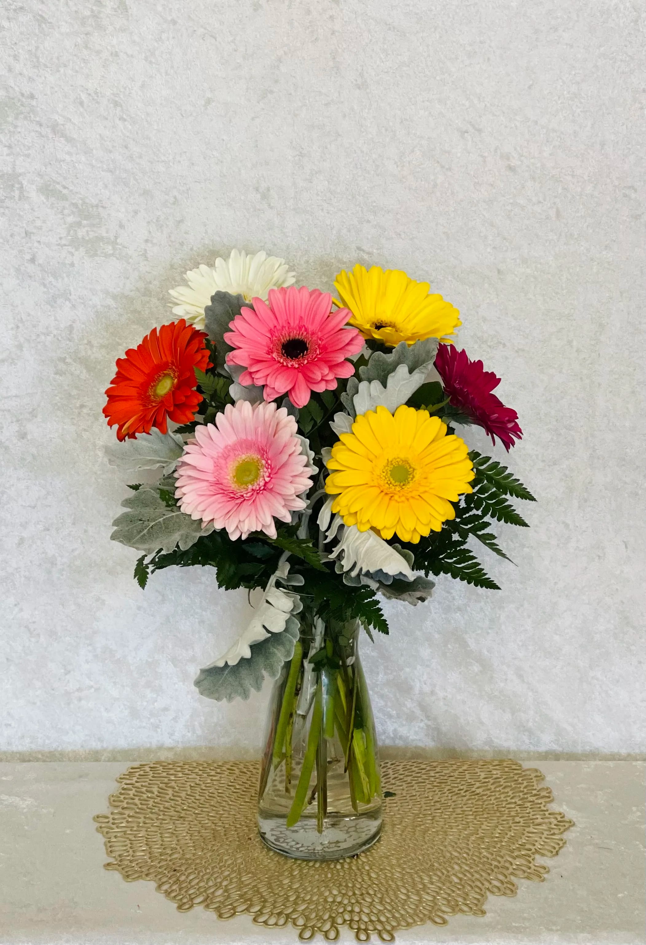Gerber me Happy Gerber me Happy - Exuberant blooms are Gerbera Daisy Flowers with their bright vivacious colors and dainty button centers. These blossoms are ideal when a boost of cheer is needed! Bright the day of that especial someone with this gorgeous arrangement.