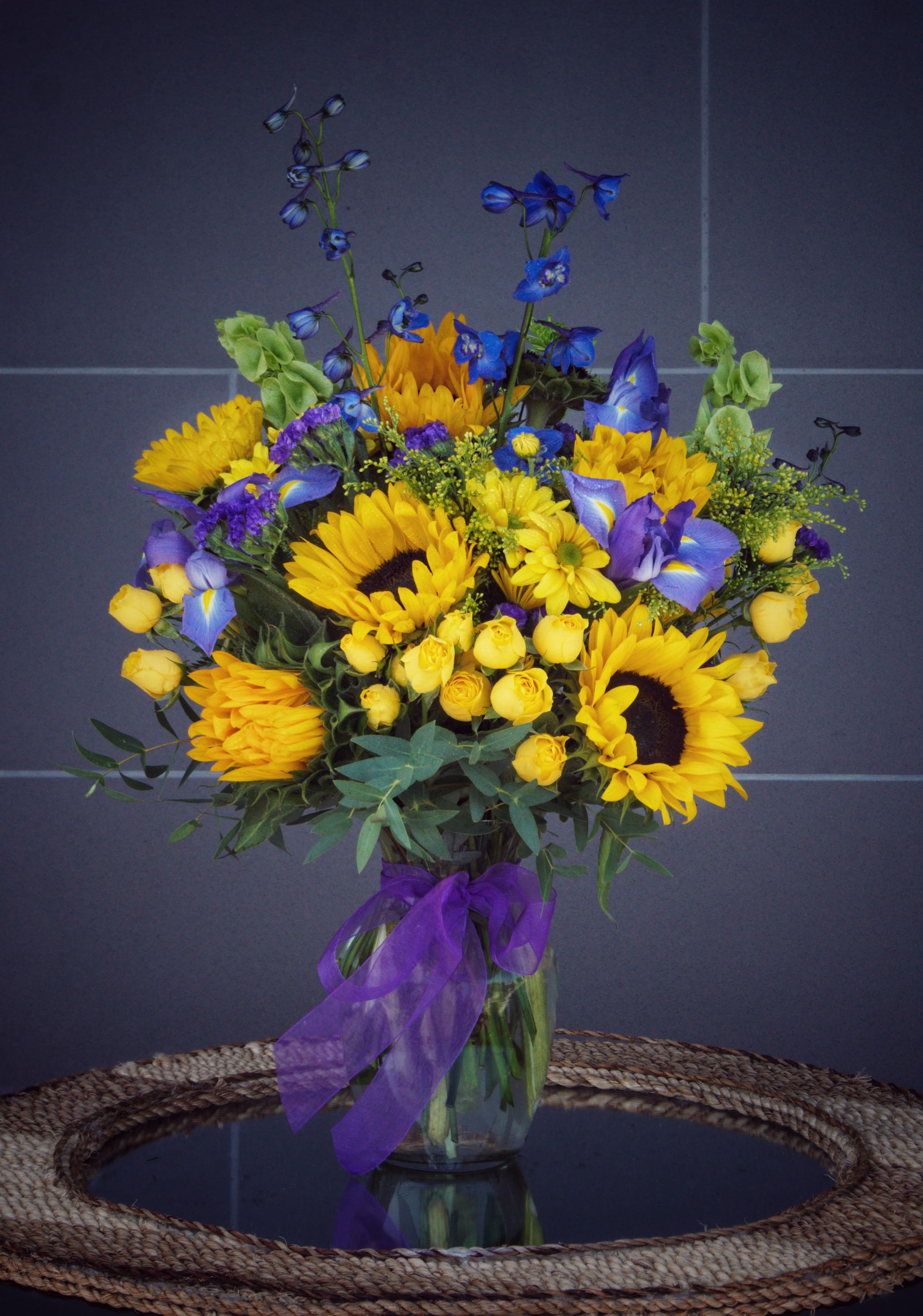 Sunshine Smile - Cheerful design including rose, sunflower, iris, delphinium...and accents.