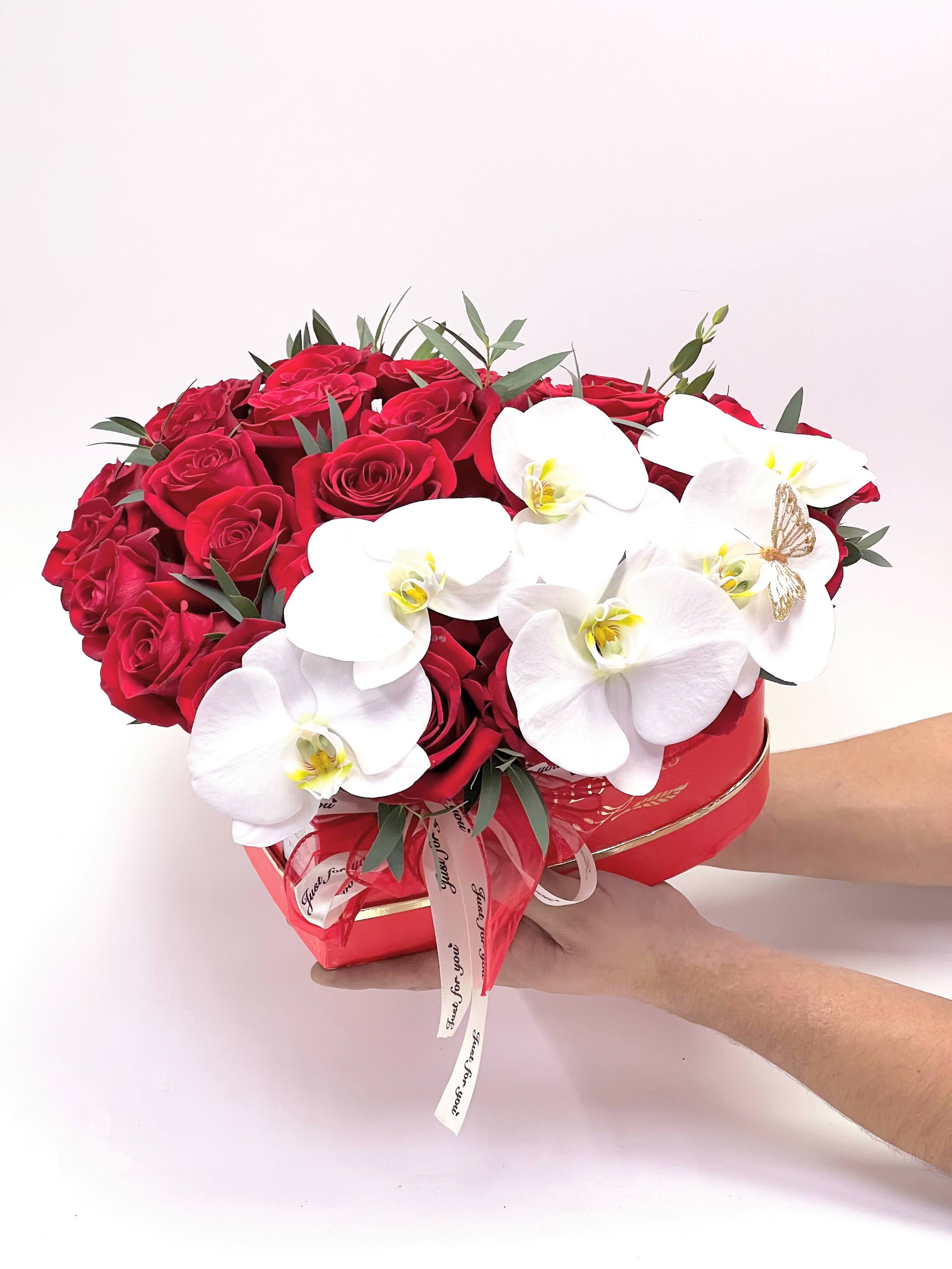 Rozaliya. - 25 red roses with white Phelaenopsis Orchids