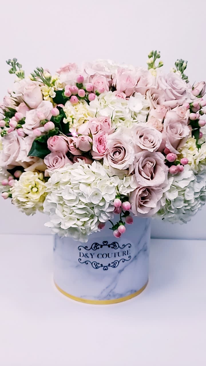 Sofia - Blushing arrangement is filled with classic white hydrangeas, blush and white roses in D&amp;Y Couture's Signature Marble Box    Substitution Policy: In some instances, the florist photo may represent an overall theme or look and include a one-of-a-kind vase which cannot be exactly replicated.  Although the actual bouquet may not precisely match the photo, its temperament will. Occasionally, substitutions of flowers or containers happen due to weather, seasonality and market conditions which may affect availability. If this is the case with the gift you've selected, the local florist will ensure that the style, theme and color scheme of your arrangement is preserved and will only substitute items of equal or higher value. 