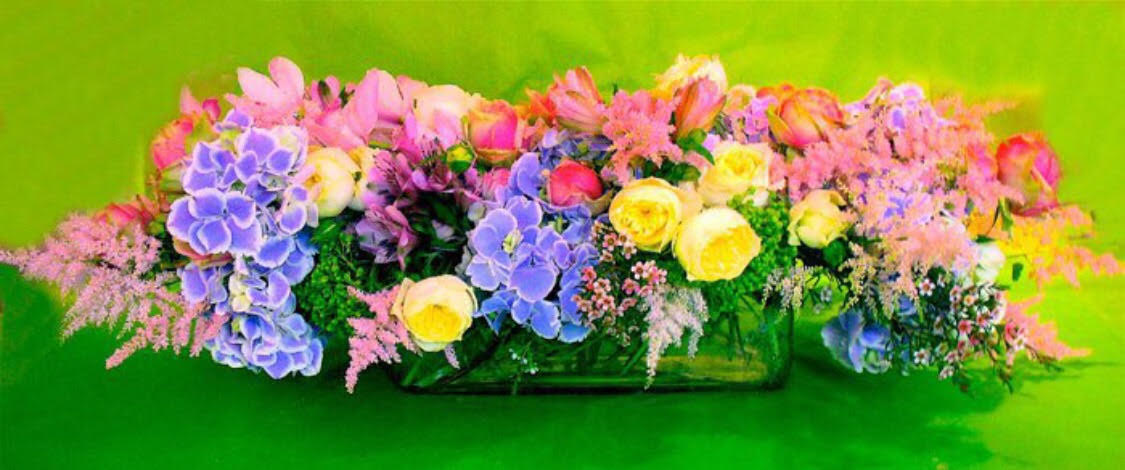 Flower Child Fresh Centerpiece - Arrangement with purple, pink, and yellow flowers.