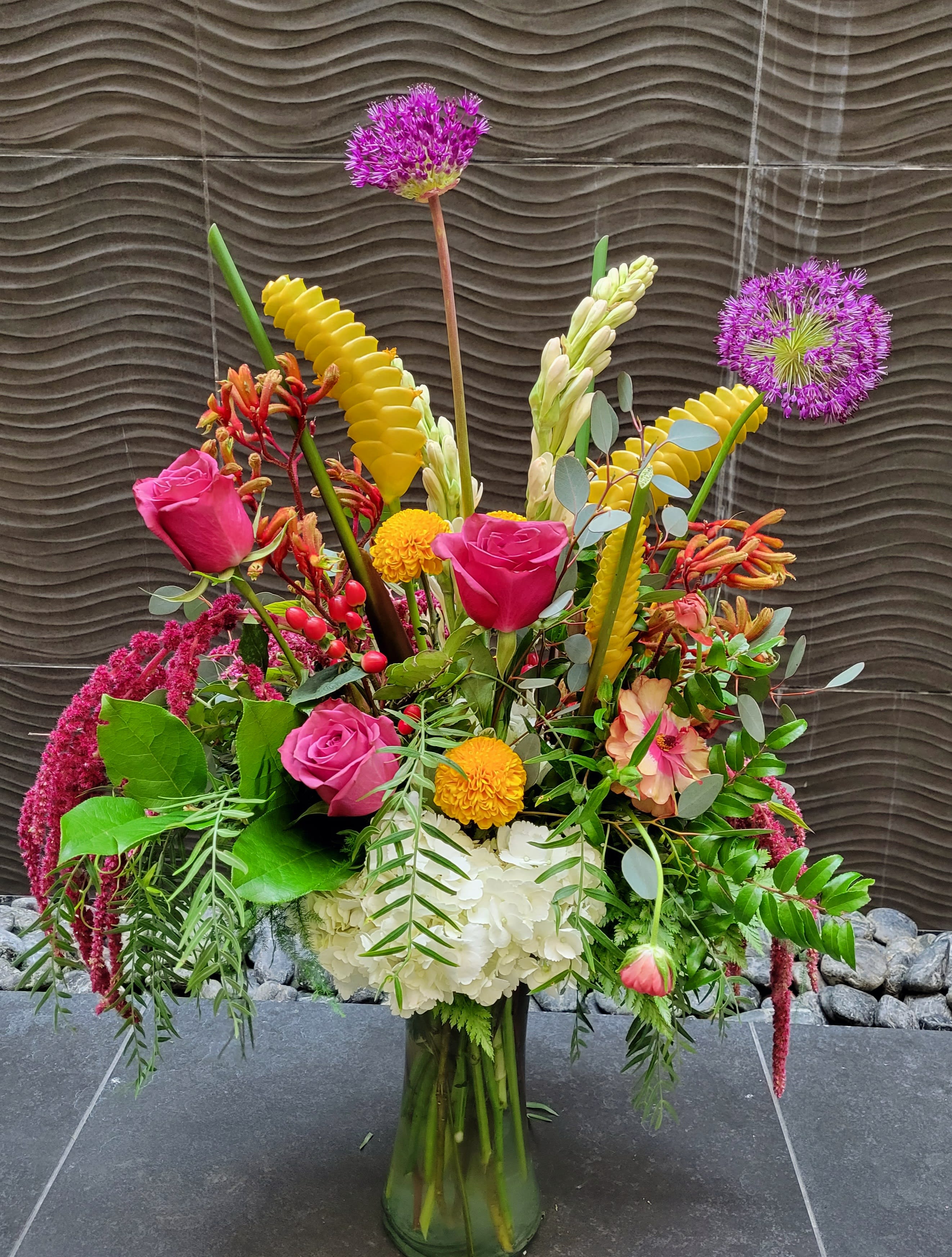 tropic thunder - Crazy beautiful Hawaiian raddle snake calathea, allium , blueberry roses, hanging amaranthus. this arrangement is for the mom that says I love flowers and you want to surprise with a wow arrangement!