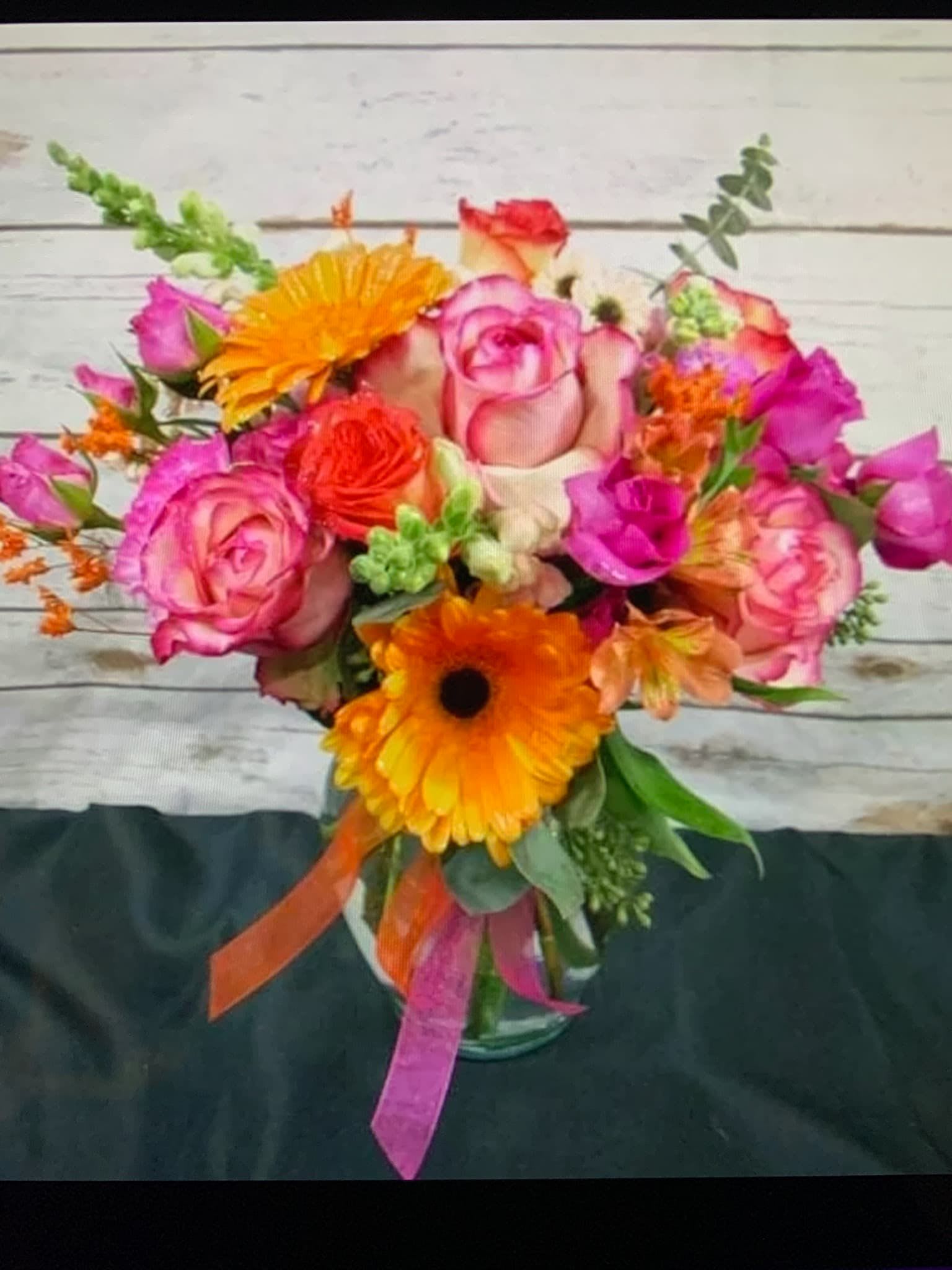 Fiesta Bright Fiesta Bright - Beautiful Bright Colors Mixed together using seasonal flowers and the brightest colors available. Please note that some of the flowers will not always be available but we will get as close as possible.
