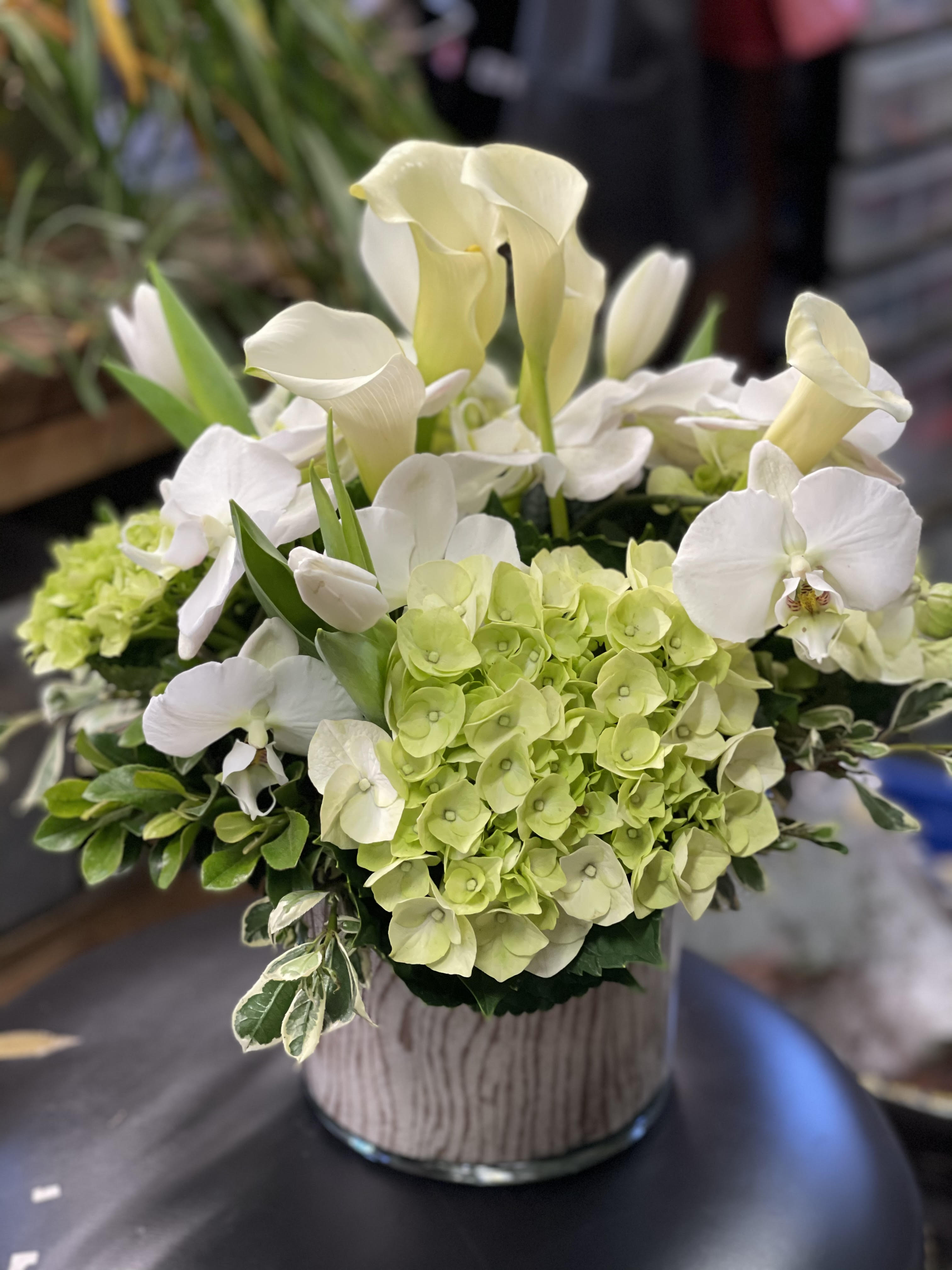 From Our Garden To You - The picture on display is an example of Deluxe fresh cut flowers from our garden at the Green Fashion Nursery.   This arrangement guarantees freshness and glamour but no color or type of flower.   