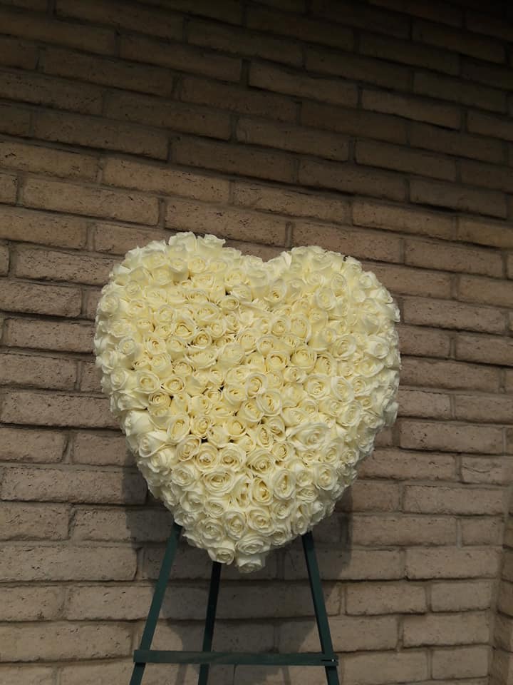 Loving Heart  - An arrangement of roses in this beautiful standing heart – created with care – will express your deepest love and devotion to all in attendance.  Note in special intrusions which color. 