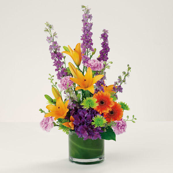 Thoughts and Love - Bright-colored lilies, hydrangea, Gerbera daisies, carnations, pompons and larkspur are lively and soothing at the same time.