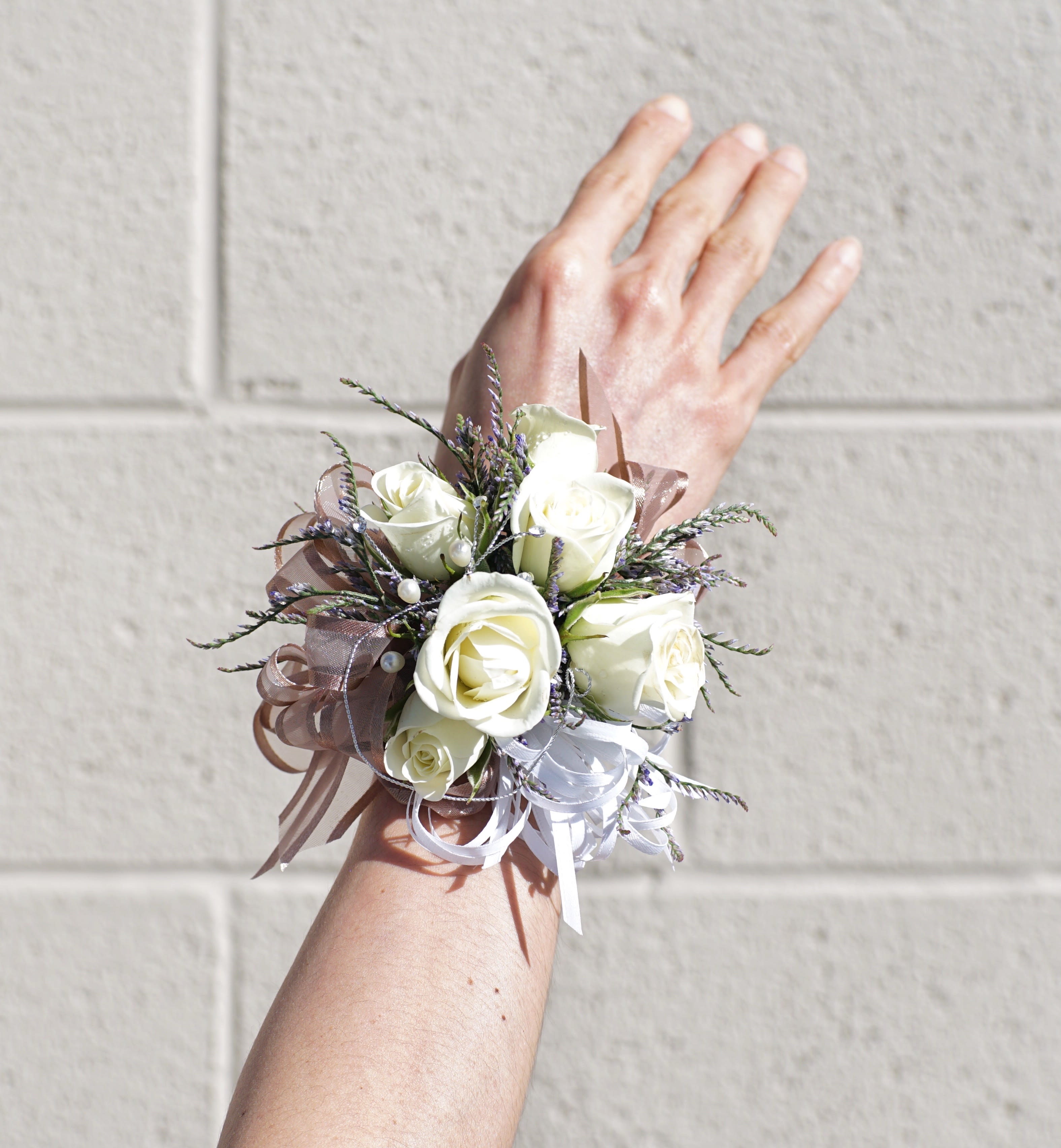Wrist Corsage 5 - Wrist corsage with white roses and accents. CUSTOMER CAN CHOOSE ANY COLOR STANDARD: WRIST CORSAGE DELUXE: WRIST CORSAGE + BOUTONNIERE